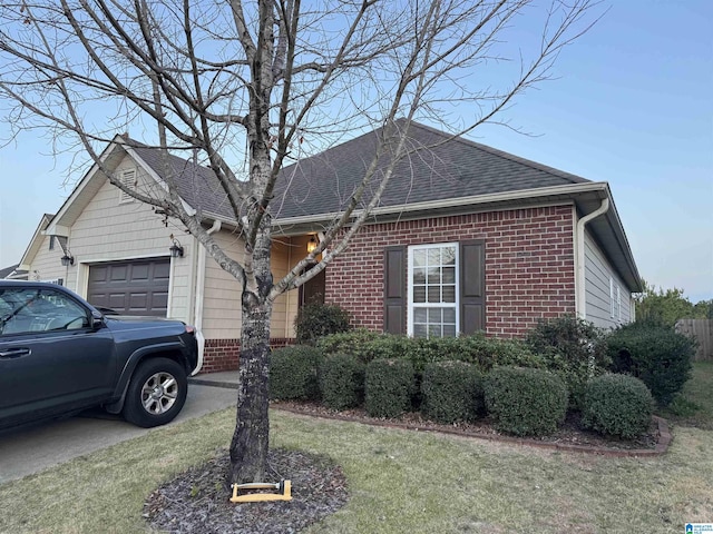 1021 Crawford Ct, Chelsea, AL 35043 - ranch-style home featuring brick siding, driveway, a shingled roof, and an attached garage