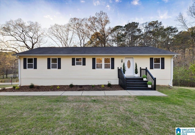ranch-style home with a front yard