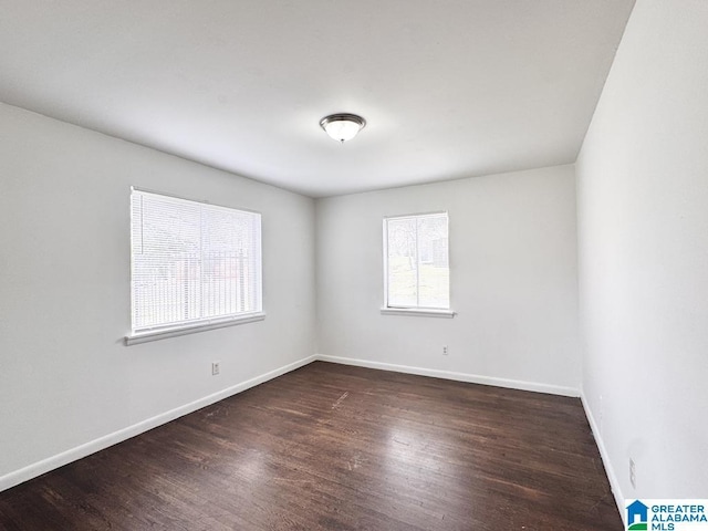 7709 7th Ave S, Birmingham, AL 35206 - unfurnished room featuring baseboards and wood finished floors