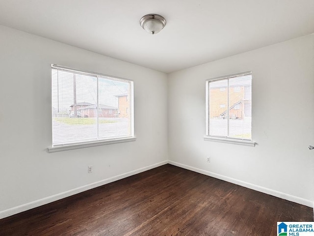 7709 7th Ave S, Birmingham, AL 35206 - spare room featuring dark wood finished floors and baseboards