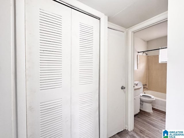 7709 7th Ave S, Birmingham, AL 35206 - bathroom featuring shower / bathing tub combination, toilet, and wood finished floors