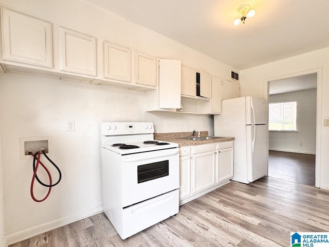 7709 7th Ave S, Birmingham, AL 35206 - kitchen featuring visible vents, white appliances, baseboards, a sink, and light wood-style floors