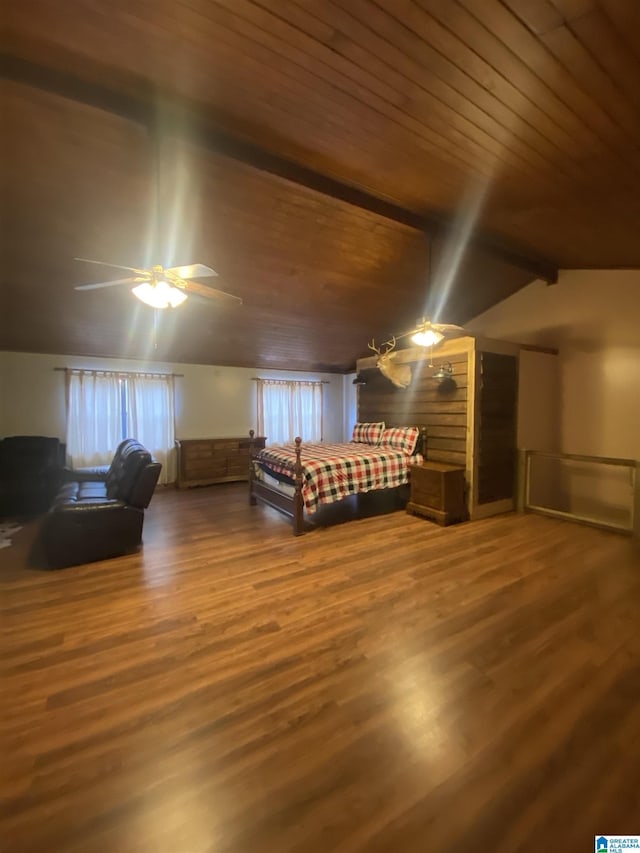 unfurnished bedroom featuring a ceiling fan, wooden ceiling, vaulted ceiling with beams, and wood finished floors