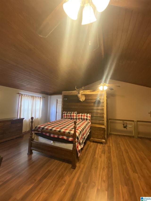 bedroom featuring lofted ceiling, wood finished floors, and wooden ceiling
