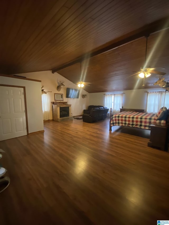 unfurnished bedroom with wood ceiling, vaulted ceiling with beams, a fireplace, and wood finished floors