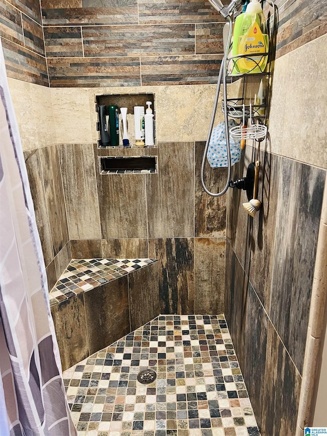 bathroom with tiled shower