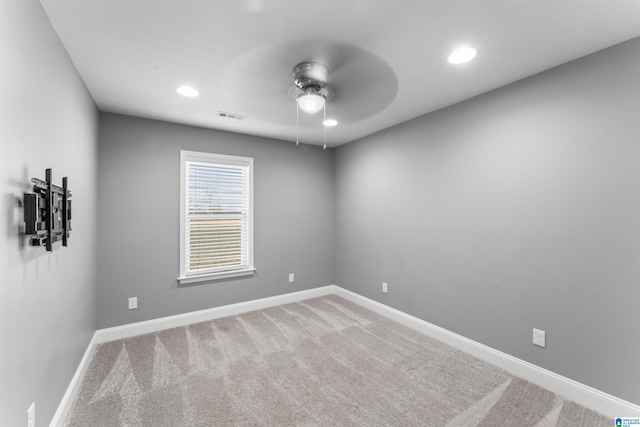 carpeted empty room featuring baseboards, visible vents, ceiling fan, and recessed lighting