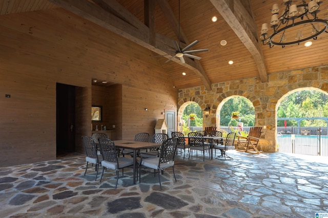 view of patio / terrace with a fenced in pool, outdoor dining area, fence, and ceiling fan