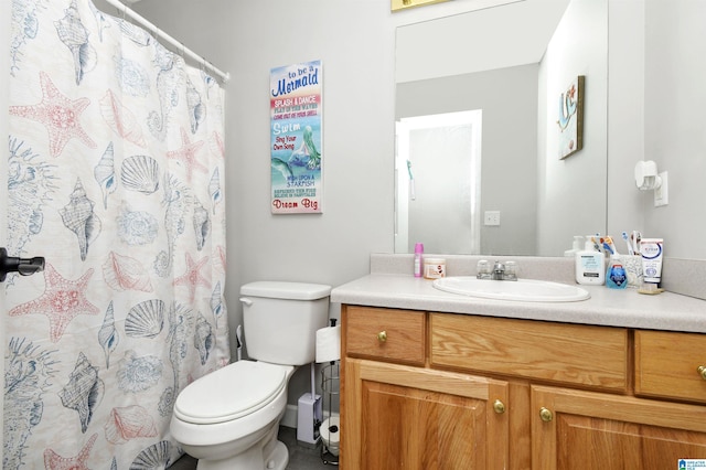 full bathroom with toilet, vanity, and a shower with shower curtain