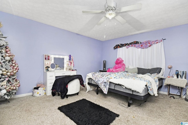 bedroom with baseboards, a textured ceiling, ceiling fan, and carpet