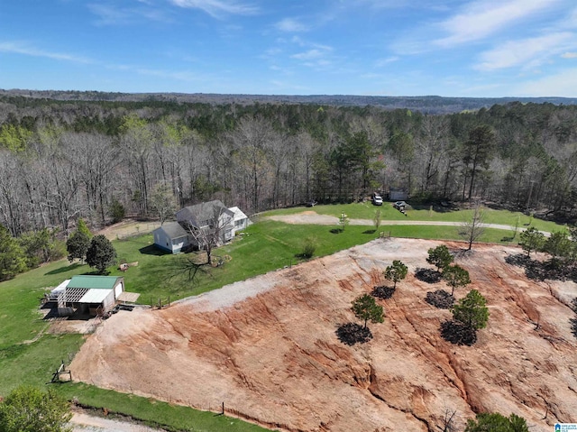 birds eye view of property with a forest view