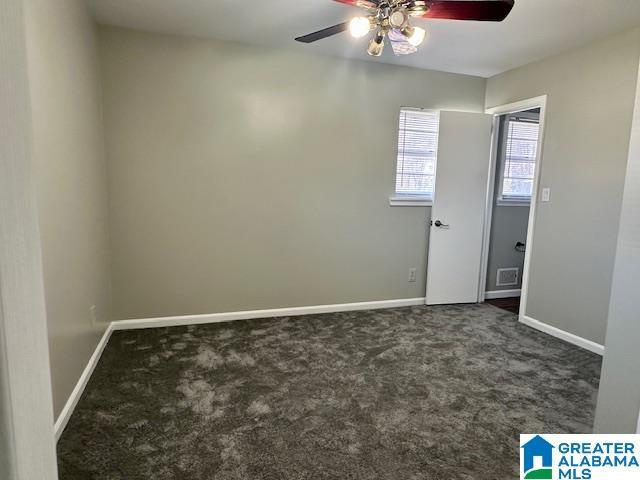 unfurnished room featuring baseboards, visible vents, ceiling fan, and carpet flooring