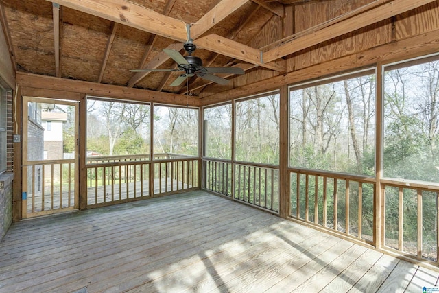 unfurnished sunroom featuring a ceiling fan