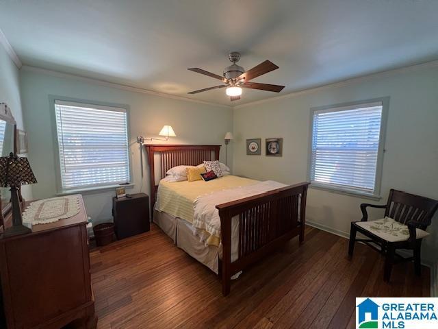 881 Ridgeway Cir, Talladega, AL 35160 - bedroom featuring ornamental molding, multiple windows, ceiling fan, and wood finished floors