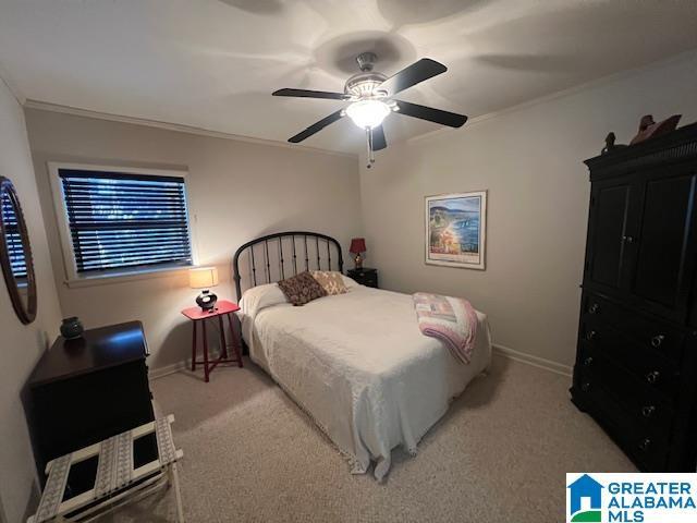 881 Ridgeway Cir, Talladega, AL 35160 - carpeted bedroom with a ceiling fan, ornamental molding, and baseboards