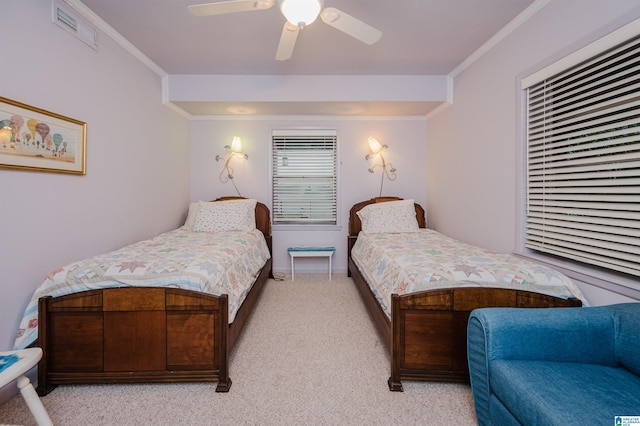 881 Ridgeway Cir, Talladega, AL 35160 - bedroom featuring visible vents, baseboards, ornamental molding, a ceiling fan, and light carpet