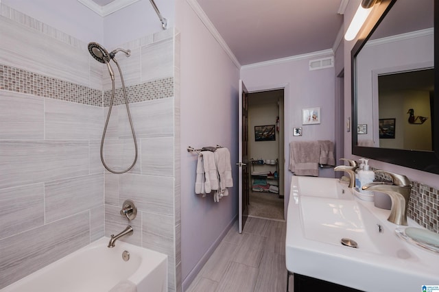 881 Ridgeway Cir, Talladega, AL 35160 - ensuite bathroom featuring a sink, shower / bathtub combination, crown molding, and visible vents
