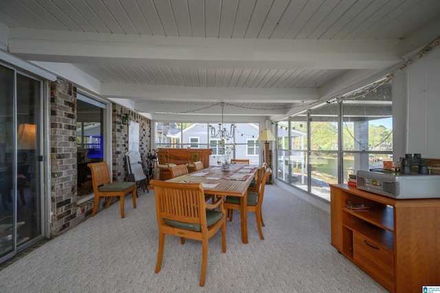 881 Ridgeway Cir, Talladega, AL 35160 - sunroom / solarium featuring a chandelier, beam ceiling, a hot tub, and outdoor dining space