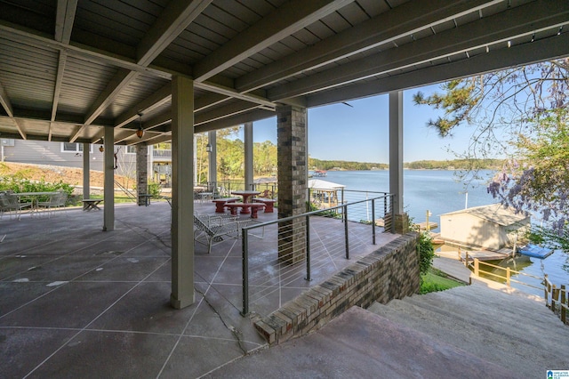 881 Ridgeway Cir, Talladega, AL 35160 - view of patio / terrace featuring outdoor dining space, a water view, and a dock