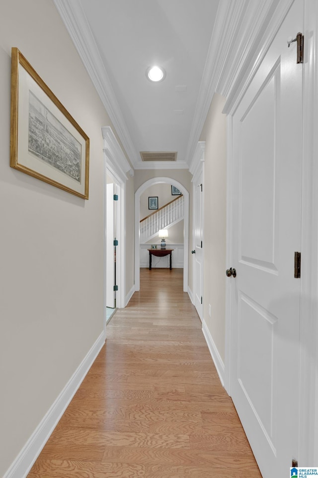 2326 Freestone Ridge Cv, Hoover, AL 35226 - hallway with arched walkways, crown molding, light wood finished floors, baseboards, and recessed lighting