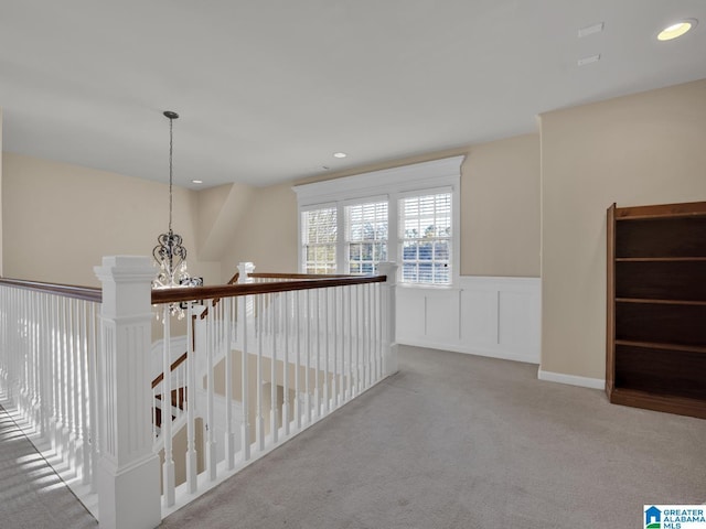 2326 Freestone Ridge Cv, Hoover, AL 35226 - corridor with an upstairs landing, carpet floors, a wainscoted wall, a chandelier, and recessed lighting