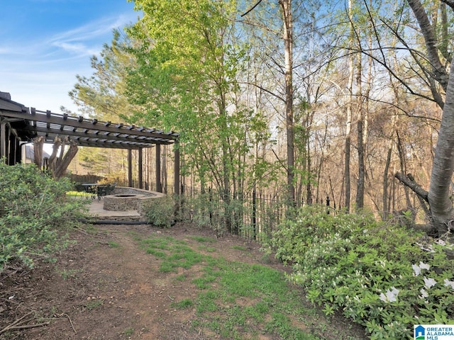 2326 Freestone Ridge Cv, Hoover, AL 35226 - view of yard featuring a pergola, an outdoor fire pit, and a patio area