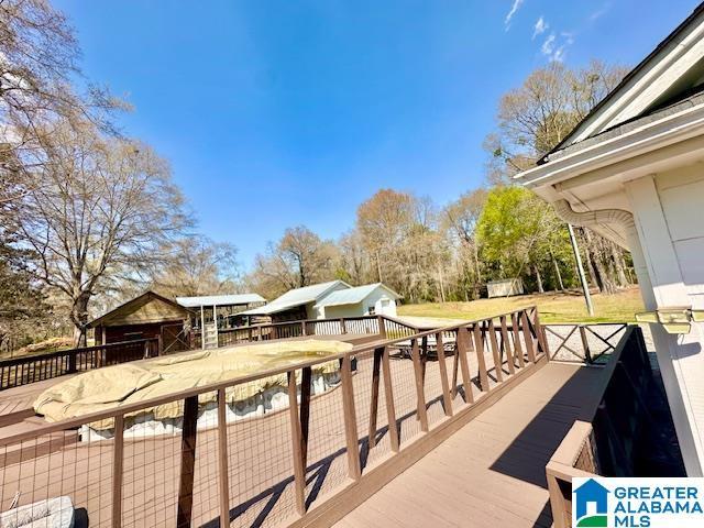 deck featuring an outdoor structure