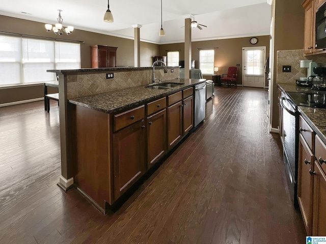 kitchen with a sink, electric stove, dark wood finished floors, black microwave, and stainless steel dishwasher