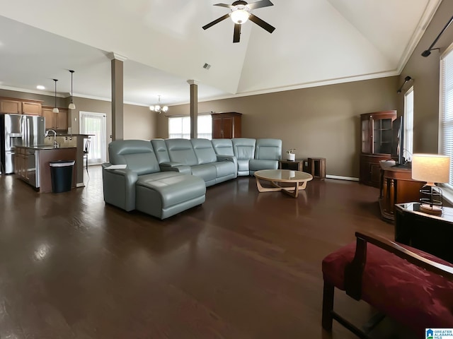 living area with visible vents, a ceiling fan, crown molding, ornate columns, and high vaulted ceiling