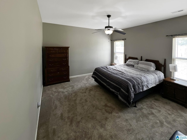 bedroom with visible vents, ceiling fan, multiple windows, and carpet
