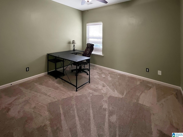 office area featuring carpet, baseboards, and ceiling fan