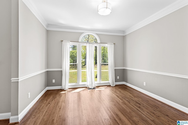 206 Shaw Rd, Pell City, AL 35128 - empty room featuring wood finished floors, crown molding, and baseboards