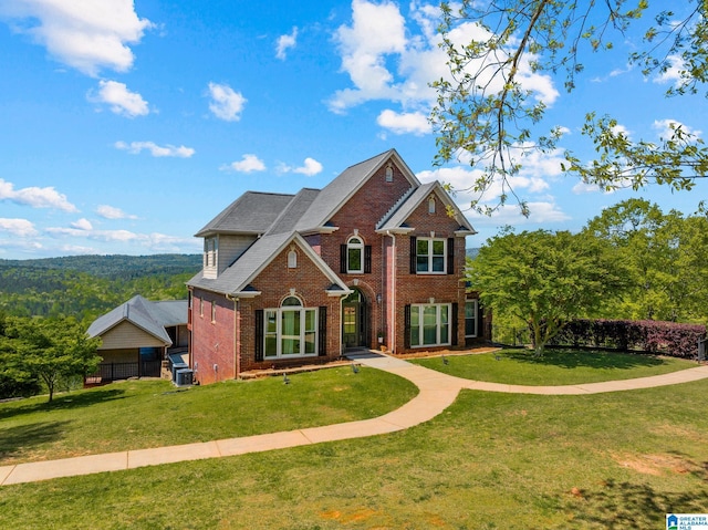 206 Shaw Rd, Pell City, AL 35128 - traditional-style house with brick siding and a front yard
