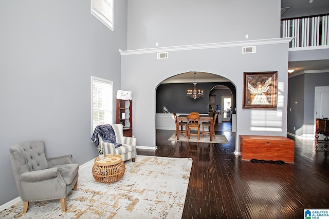 8014 Waterford Dr, Pinson, AL 35126 - living room featuring arched walkways, a high ceiling, and visible vents