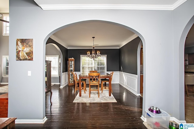 8014 Waterford Dr, Pinson, AL 35126 - dining room with an inviting chandelier, a wainscoted wall, ornamental molding, and hardwood / wood-style floors