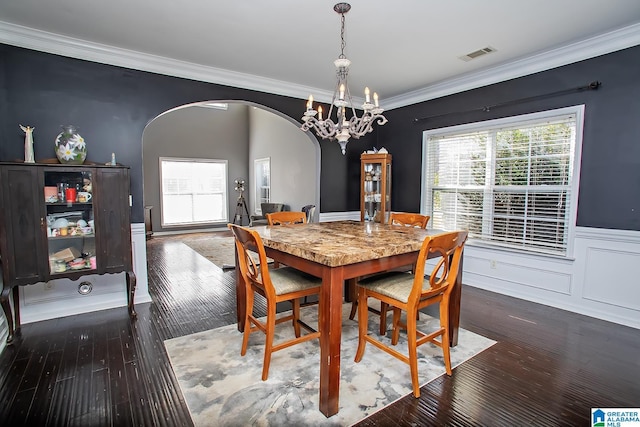 8014 Waterford Dr, Pinson, AL 35126 - dining space with visible vents, crown molding, arched walkways, hardwood / wood-style flooring, and a chandelier