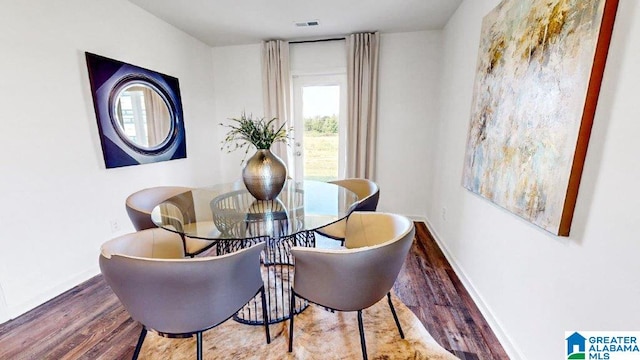 595 Sterling Pl, Odenville, AL 35120 - dining area featuring visible vents, baseboards, and wood finished floors