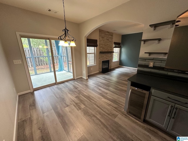 6777 Southern Trace Cir, Leeds, AL 35094 - living area with a wealth of natural light, wood finished floors, visible vents, and baseboards