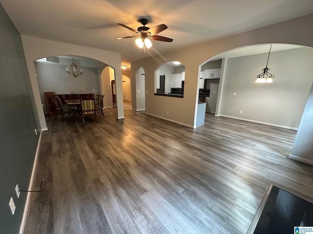 6777 Southern Trace Cir, Leeds, AL 35094 - living room with ceiling fan, baseboards, and dark wood-style flooring