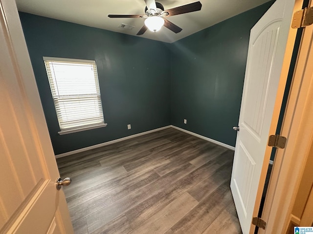 6777 Southern Trace Cir, Leeds, AL 35094 - spare room featuring baseboards, visible vents, dark wood-style floors, and ceiling fan