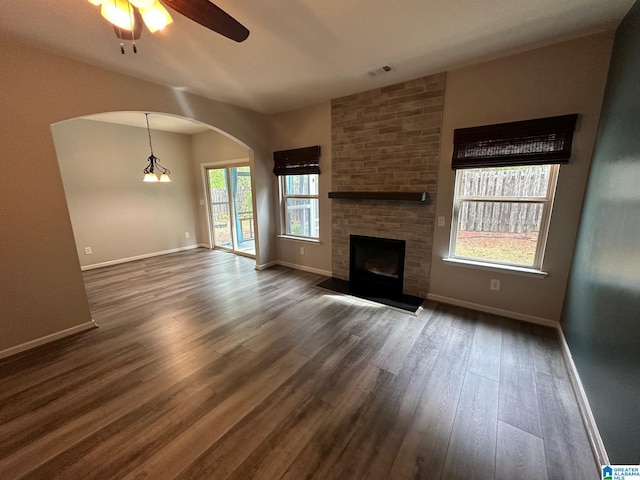 6777 Southern Trace Cir, Leeds, AL 35094 - unfurnished living room featuring dark wood-type flooring, visible vents, and baseboards