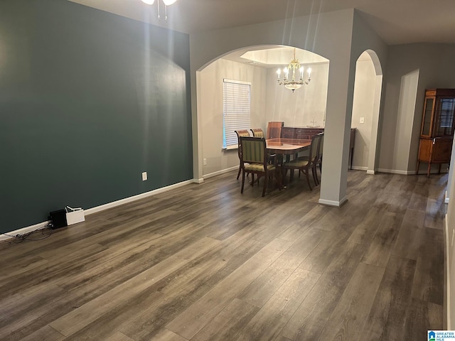 6777 Southern Trace Cir, Leeds, AL 35094 - dining space with baseboards, arched walkways, a chandelier, and dark wood-style flooring