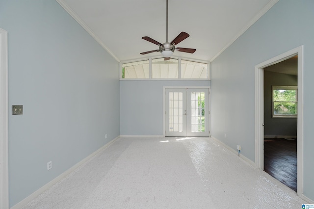 unfurnished room with a ceiling fan, french doors, ornamental molding, and lofted ceiling