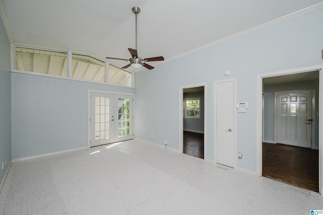 interior space featuring french doors, baseboards, a ceiling fan, and crown molding