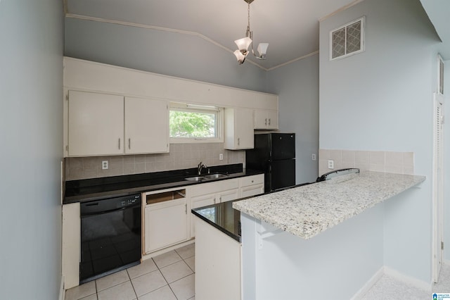 kitchen featuring a peninsula, black appliances, visible vents, decorative backsplash, and a sink