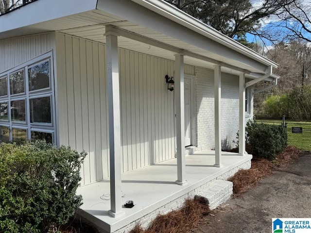 view of property exterior with covered porch