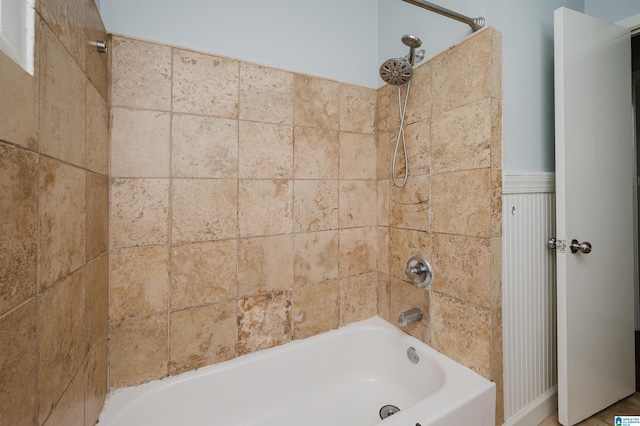 full bathroom with wainscoting and tub / shower combination