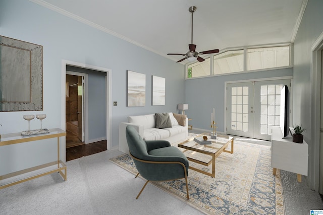 living room with french doors, ceiling fan, baseboards, and ornamental molding
