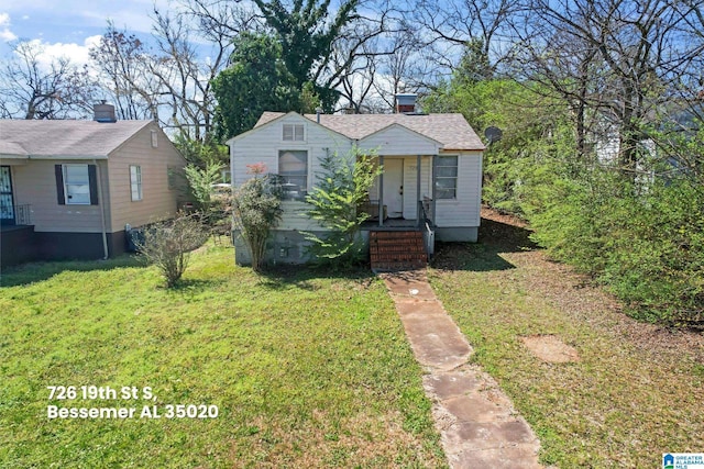 bungalow-style home featuring a front yard