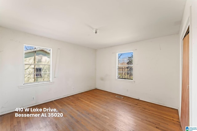 unfurnished bedroom with a closet and wood finished floors